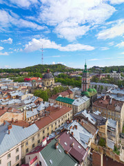 Fototapeta premium Aerial view on Dominican Church and Dormition Church in Lviv, Ukraine from drone