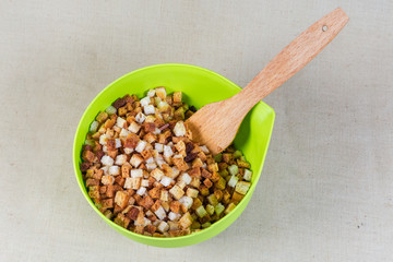 Pieces of dried bread in form of cubes, top view