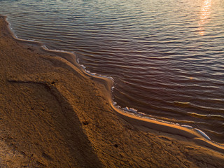 Late evening view of old bridge and new bridge over small river.