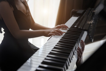 Fototapeta premium hand kids practice play piano for up skill of music
