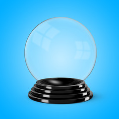Glass crystal ball mounted on a black painted wooden base