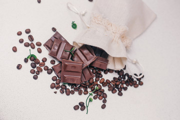 Chocolate, coffee beans on the table, top view