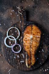 Grilled salmon on cutting board