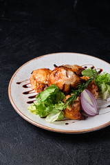 Grilled meat skewers, shish kebab on the white plate, onion, salad, rosemary