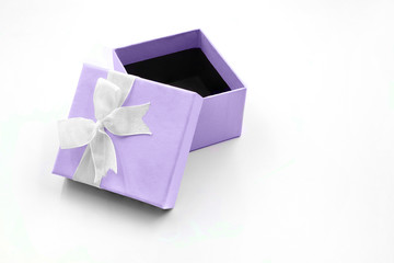 light purple gift box with ribbon on white background