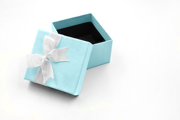 gift box white ribbon on light blue color box isolated on white background