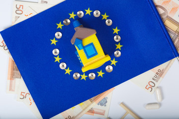 European flag,rubber house and european currency. Top view