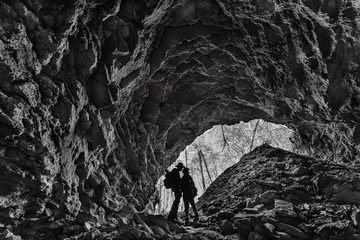 A man and a woman in a cave