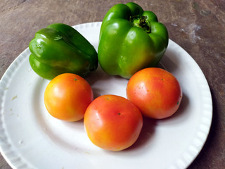 some fresh healthy vegetable put in a white plate