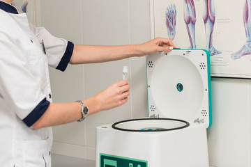 Medical equipment. Laboratory Blood test tubes in a machine for testing a virus