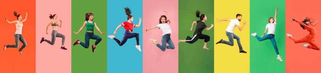 Fototapeta Young emotional people jumping high, look happy, cheerful on multicolored background. Celebrating, winning men and women. Emotions, facial expression concept. Trendy colors. Collage made of 7 models. obraz