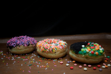 Donuts with colorful, chocolate and cheese topping