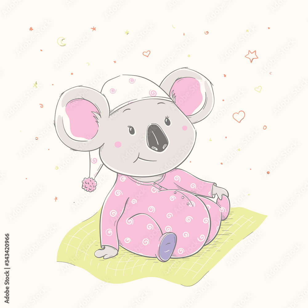 Wall mural Lovely cute koala is sitting on the grass. Beautiful koala girl dressed in pink pajamas with hat.