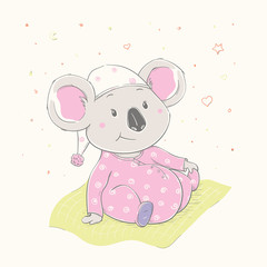 Lovely cute koala is sitting on the grass. Beautiful koala girl dressed in pink pajamas with hat. - 343420966