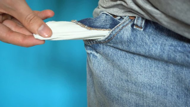The guy is looking for money in an empty pocket