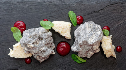 Stone-like dessert on slate plate