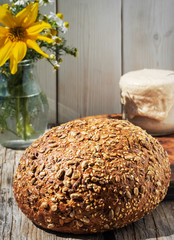 Freshly baked homemade grain bread, closeup. The concept of a healthy diet made from natural products, traditional craft bread made with natural sourdough