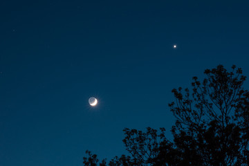 Conjunction of planet Venus and crescent moon © Menyhert