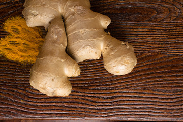 Fresh and organic ginger root and turmeric powder
