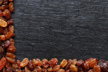 Photography of raisins on slate background for restaurant menu, label or sign