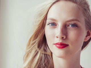 Fototapeta premium Blonde hair woman model red lipstick lips beauty portrait