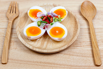 Eggs Salad on dish wooden isolated white background. Thai food.