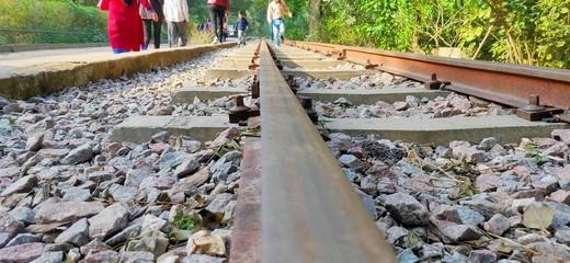 macro of railway track with people
