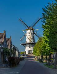 Picturesque scenery with a traditional dutch windmill called "d'Orangemolen" (in dutch) located in Willemstad, North Brabant, The Netherlands