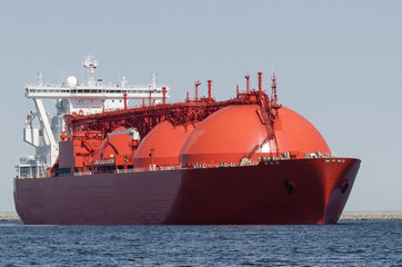 LNG TANKER - The beautiful red ship flows to the gas terminal unloading quay  © Wojciech Wrzesień