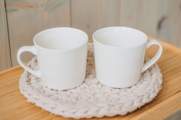 Two identical cups on a white background
