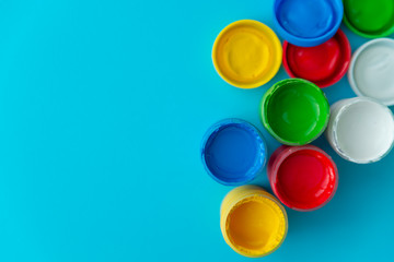 colorful paint buckets on a colored background