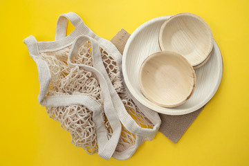 Eco-friendly different utensils yellow  background