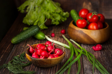 radishes in a plate on the table next to vegetables
