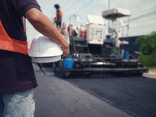 White hat and road construction (picture blurred)