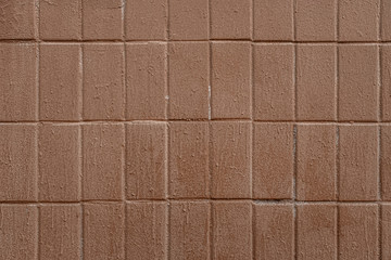 abstract background of an old tiled wall painted brown