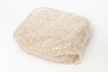 rice in a transparent bag on white background
