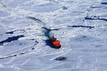 Red icebreaker in the middle of Arctic ocean © Sergey