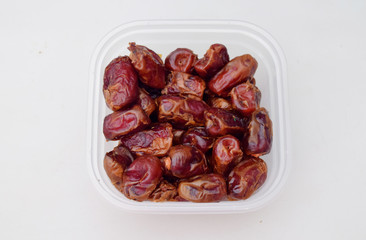 Dates in jars, Dates isolated on a white background, Ripe dates ready to eat