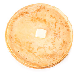 Tasty blini with butter on white background
