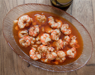 Garlic prawns on wooden table
