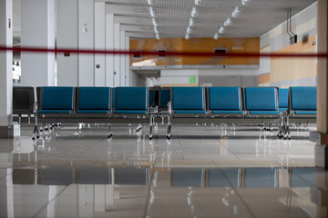 Coronavirus outbreak, empty check-in desks at the airport terminal due to pandemic of coronavirus and airlines suspended flights.