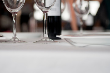 Restaurant table with crystal glasses and wine
