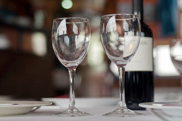 Restaurant table with crystal glasses and wine
