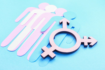 Human figures with symbol of transgender on color background. Concept of transgender