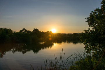 Fototapeta na wymiar Golden sunset over water, Kruger National Park, South Africa