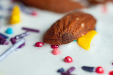 Almonds in white glaze Confectionery multi-colored decorative topping on the glaze of Easter baking.