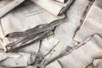 Old useless paper documents on the landfill