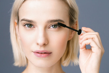 Mascara woman applying lashes make up beauty