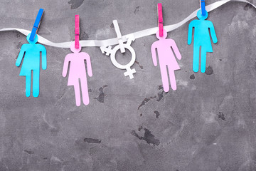 Human figures with symbol of transgender on grunge background