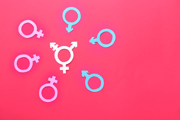 Symbols of man, woman and transgender on color background